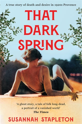 Book cover of 'That Dark Spring' by Susannah Stapleton with a woman sitting on a wall and greenery.