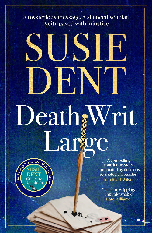 Book cover for 'Death Wit Large' by Susie Dent, featuring a dark blue background with gold and white typography and an illustration of a quill resting on stacked papers.