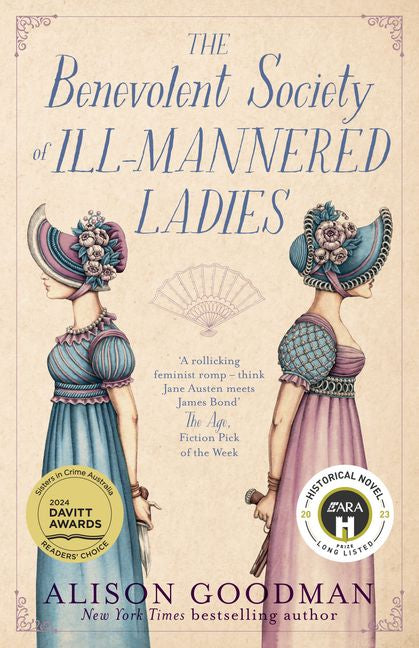 Book cover of 'The Benevolent Society of Ill-Mannered Ladies' with illustrations of two women in dresses and decorative hats.