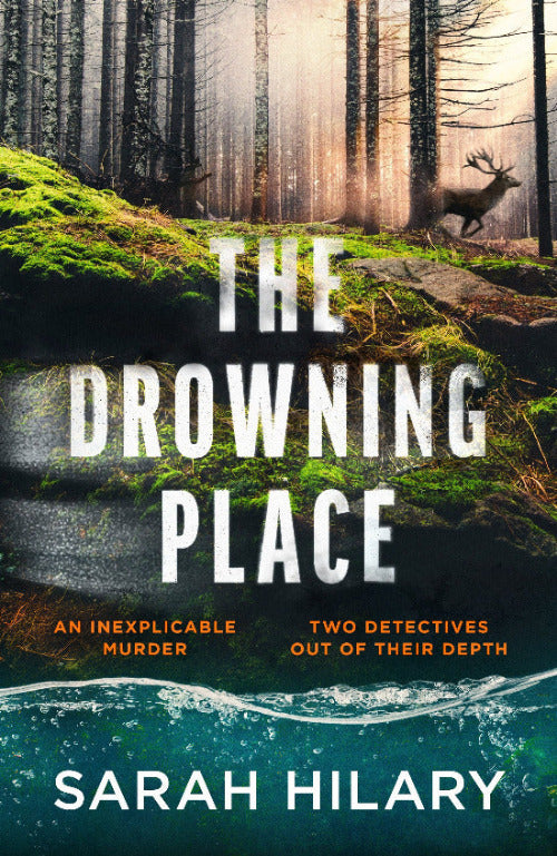 Book cover of 'The Drowning Place' with a forest and deer scene.