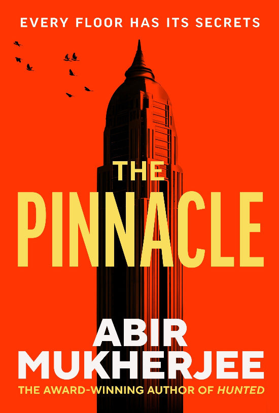 Book cover of 'The Pinnacle' by Abir Mukherjee with a skyscraper silhouette on an orange background.