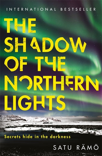 Book cover of 'The Shadow of the Northern Lights' with a green aurora borealis background.