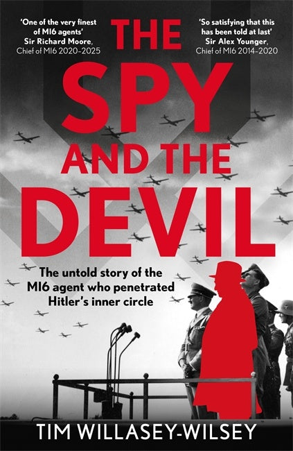 Book cover of 'The Spy and the Devil' with red text and silhouette of a spy.