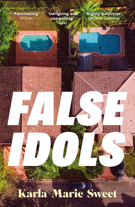 Book cover for 'False Idols' by Karla Marie Sweet, featuring an aerial photograph of suburban houses with swimming pools, overlaid with large white title text and the author's name in beige at the bottom.