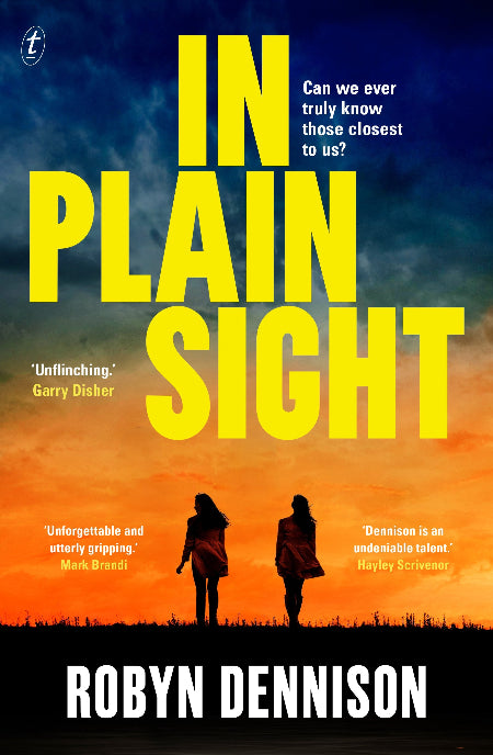 Book cover for 'In Plain Sight' by Robyn Dennison, featuring a dramatic sunset sky with two silhouetted figures walking in the foreground and large yellow title text.