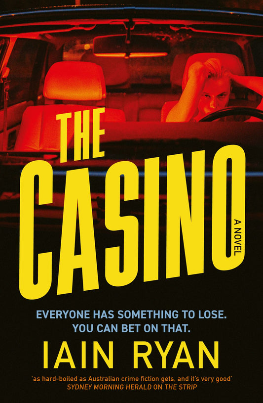 Book cover of 'The Casino' by Iain Ryan with a woman in a car and red lights.